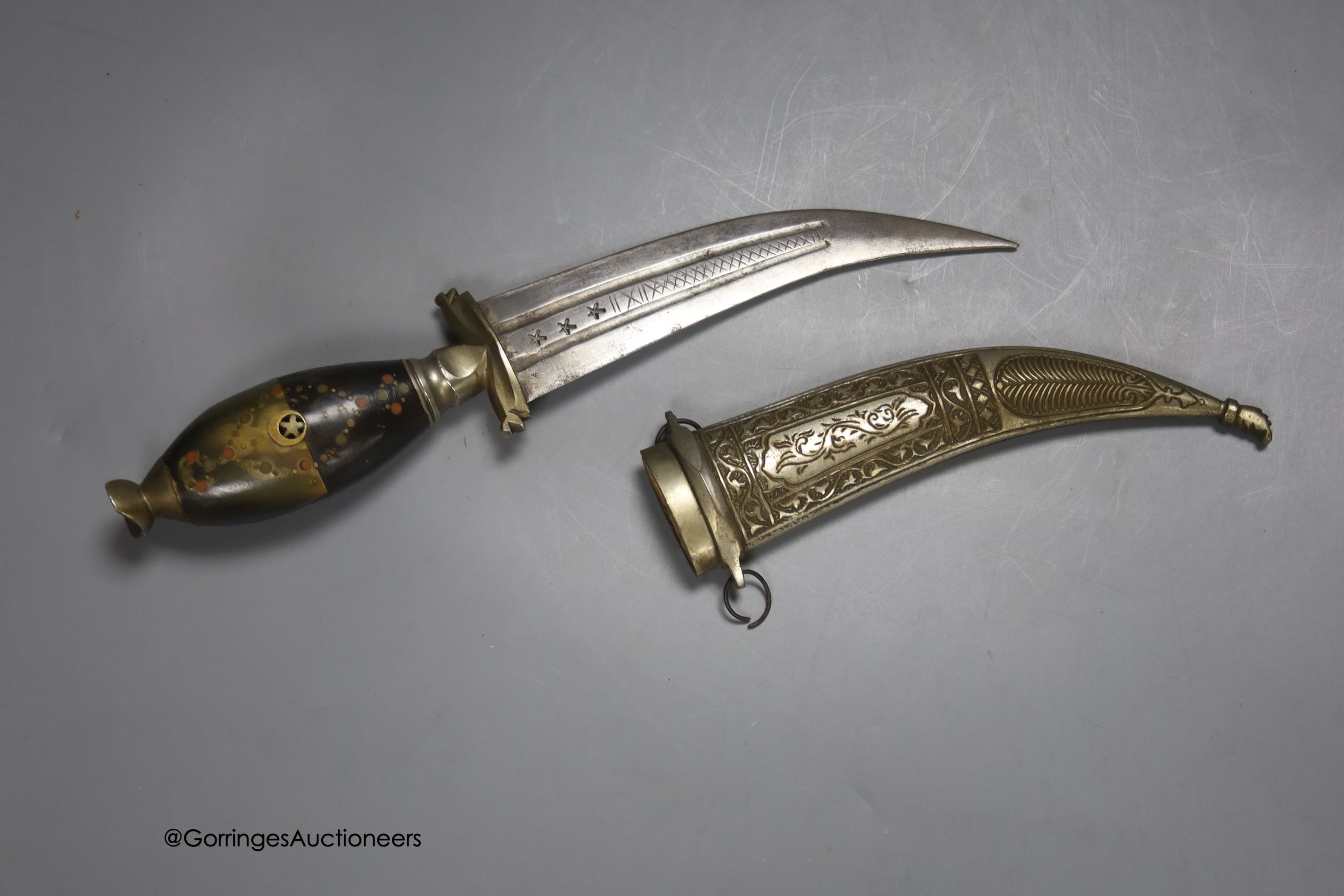 A Middle Eastern dagger, with inlaid horn handle, in sheath